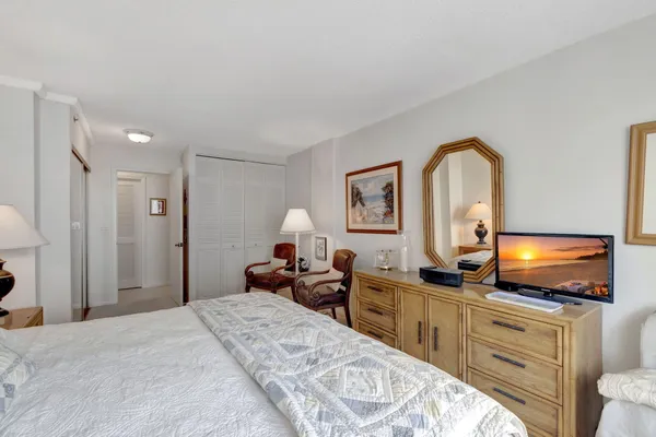 a living room with furniture and a lamp