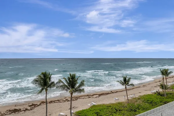 a view of a swimming pool with a lounge chairs