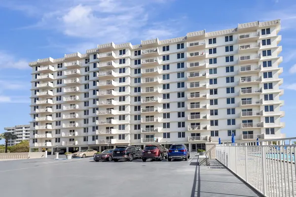 a kitchen with stainless steel appliances a sink and a refrigerator