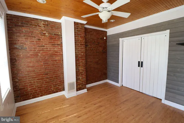 an empty room with fan