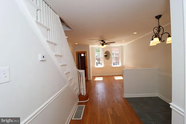 a view of entryway with wooden floor