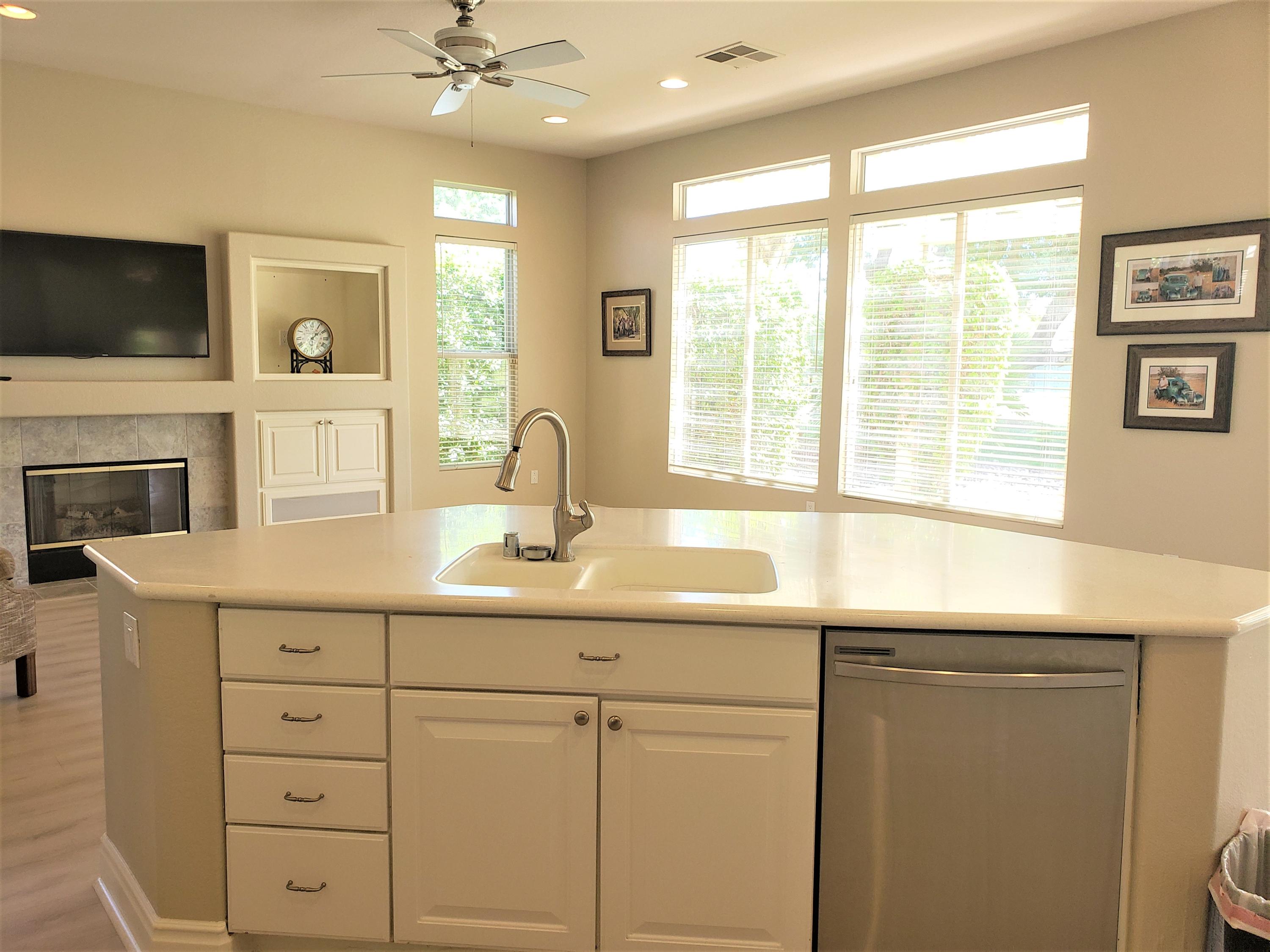 44017 Royal Troon Drive Indio, CA 92201 - Photo 14 of 33 a kitchen with a sink and a window