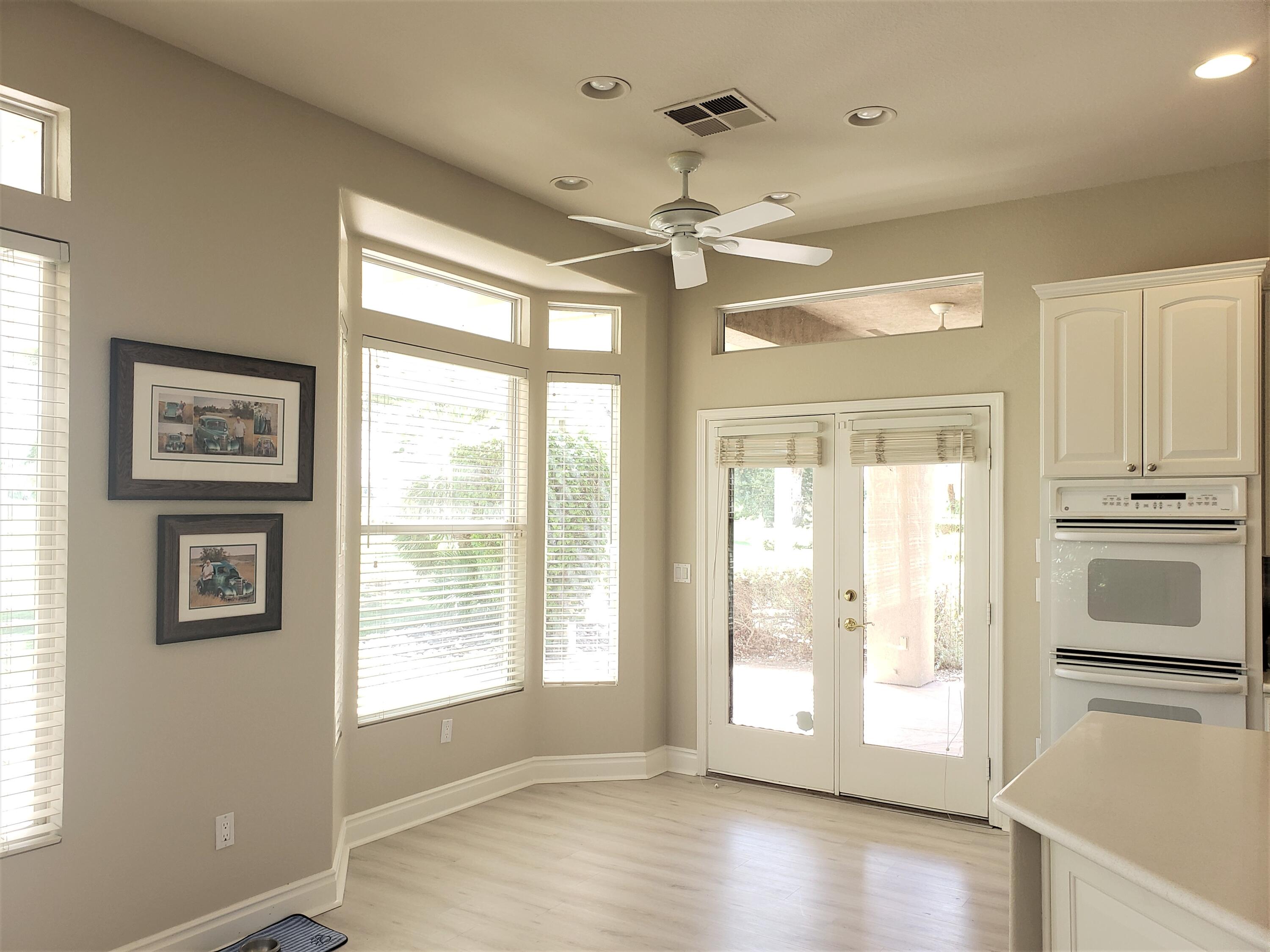 44017 Royal Troon Drive Indio, CA 92201 - Photo 16 of 33 a view of an empty room with a window and wooden floor