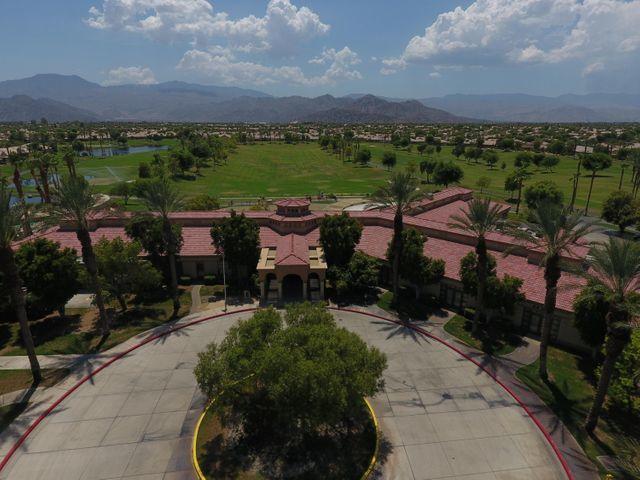 44017 Royal Troon Drive Indio, CA 92201 - Photo 26 of 33 a view of a terrace with a garden and trees