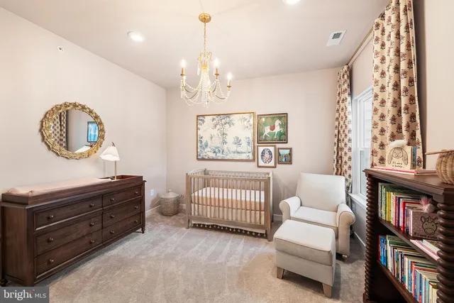 a spacious bedroom with a bed and a window