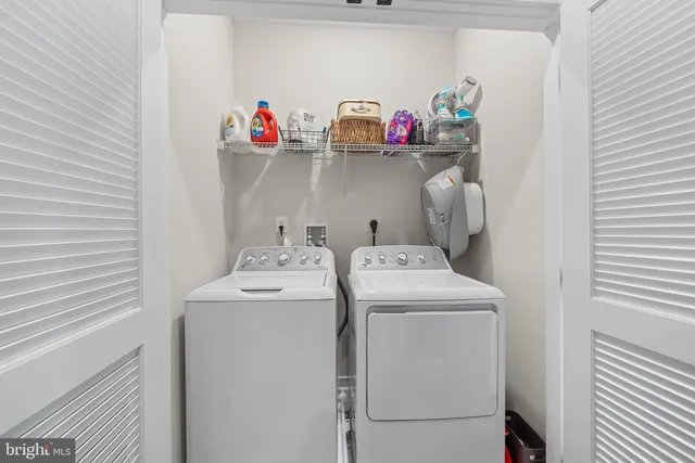 a view of hallway with livingroom and furniture