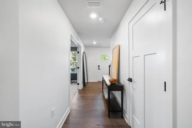 a work room with furniture and a flat screen tv