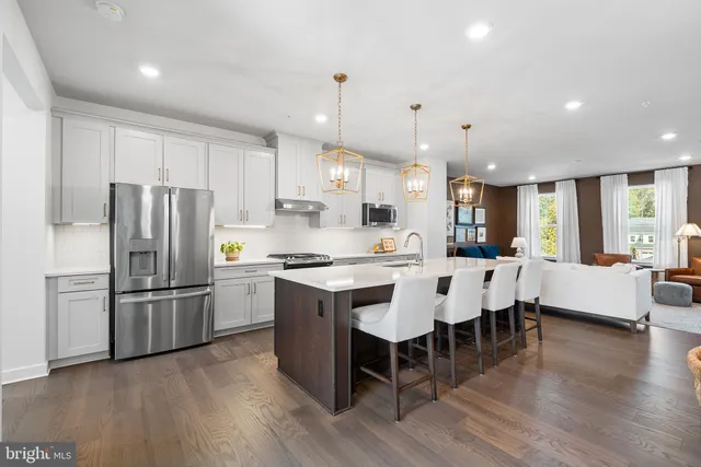 a large kitchen with a table and chairs