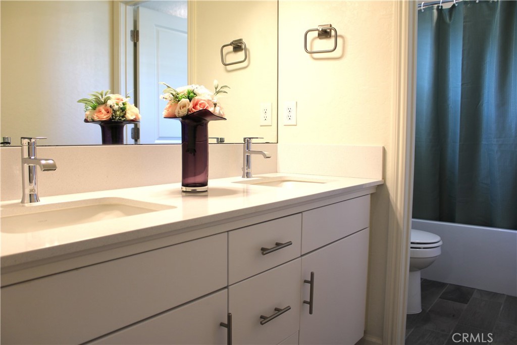 2060 North Walker Lane Clovis, CA 93619 - Photo 11 of 17 a bathroom with a sink and a toilet