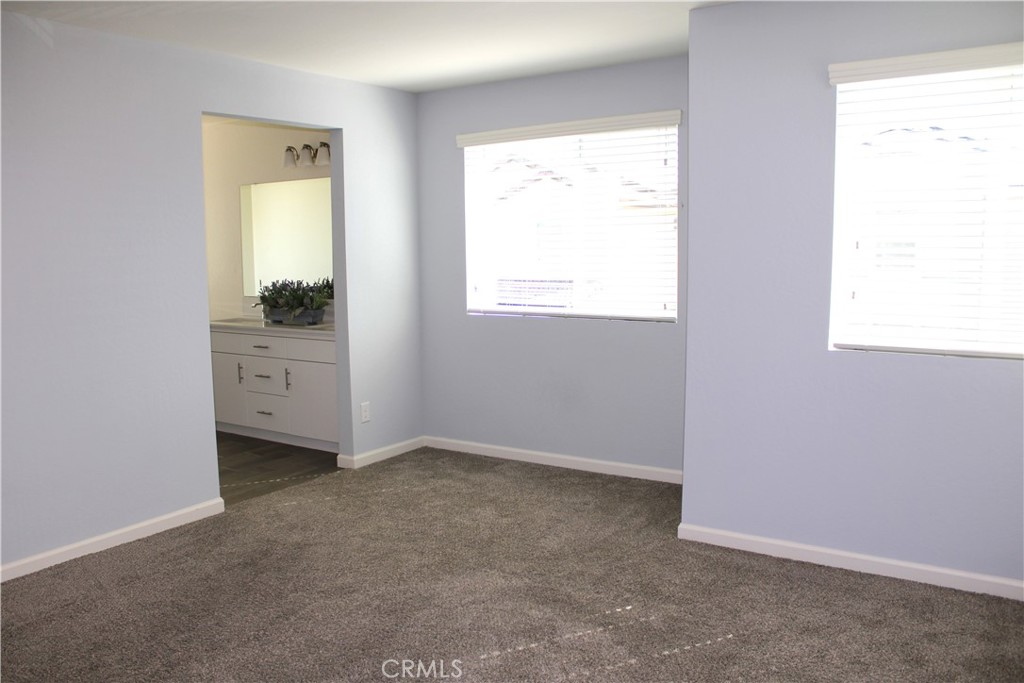 2060 North Walker Lane Clovis, CA 93619 - Photo 12 of 17 an empty room with a window and a dresser