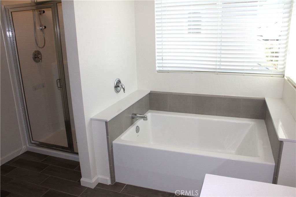 2060 North Walker Lane Clovis, CA 93619 - Photo 14 of 17 a white bath tub sitting next to a window