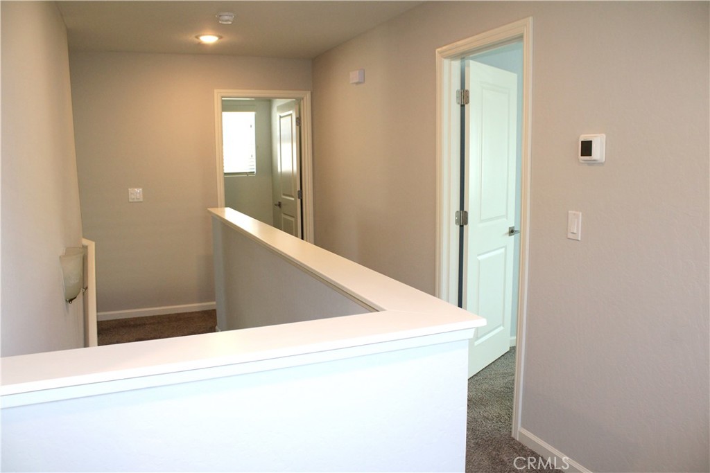 2060 North Walker Lane Clovis, CA 93619 - Photo 8 of 17 a view of a hallway with an entryway