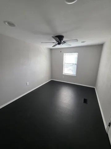 a view of a room with rack on the wall and a window