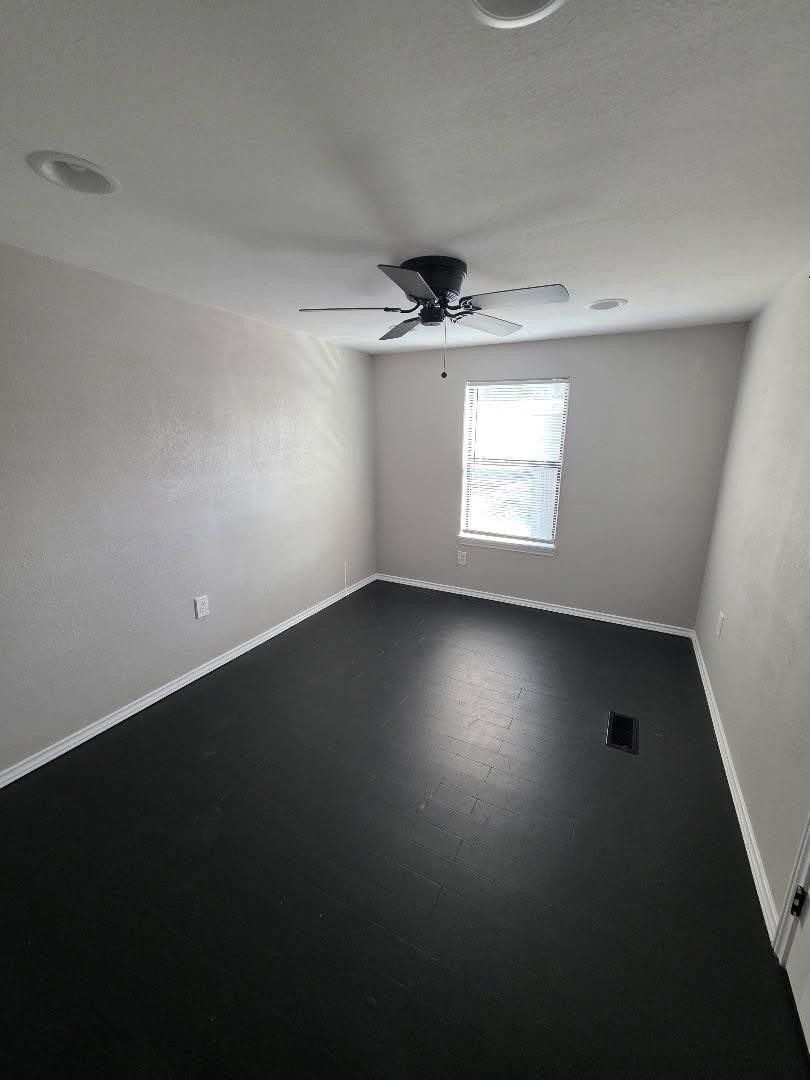 310 Paddock Street, Unit 4 Willis, TX 77378 - Photo 9 of 14 an empty room with a window