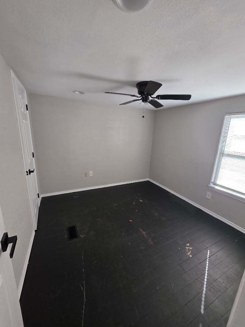 310 Paddock Street, Unit 4 Willis, TX 77378 - Photo 10 of 14 a view of a room with rack on the wall and a window