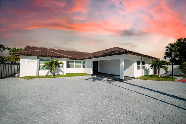 a view of a house with roof and sitting area