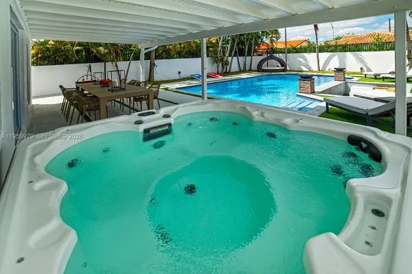 a view of a swimming pool with a patio