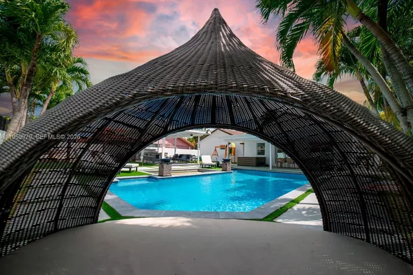 a view of swimming pool from a balcony