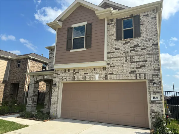 a front view of a house with parking