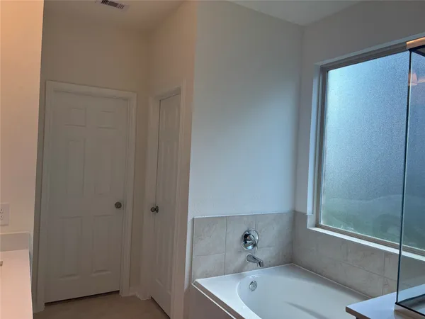 view of a room with rack on the wall