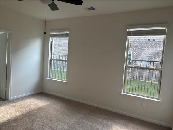 an empty room with closet and window