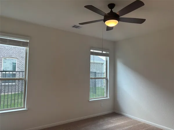 a bathroom with a bathtub sink vanity and mirror