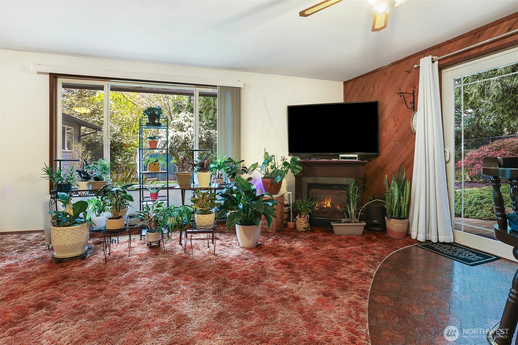 11120 3rd Place Southeast Everett, WA 98208 - Photo 16 of 35 a living room with furniture a flat screen tv and a fireplace