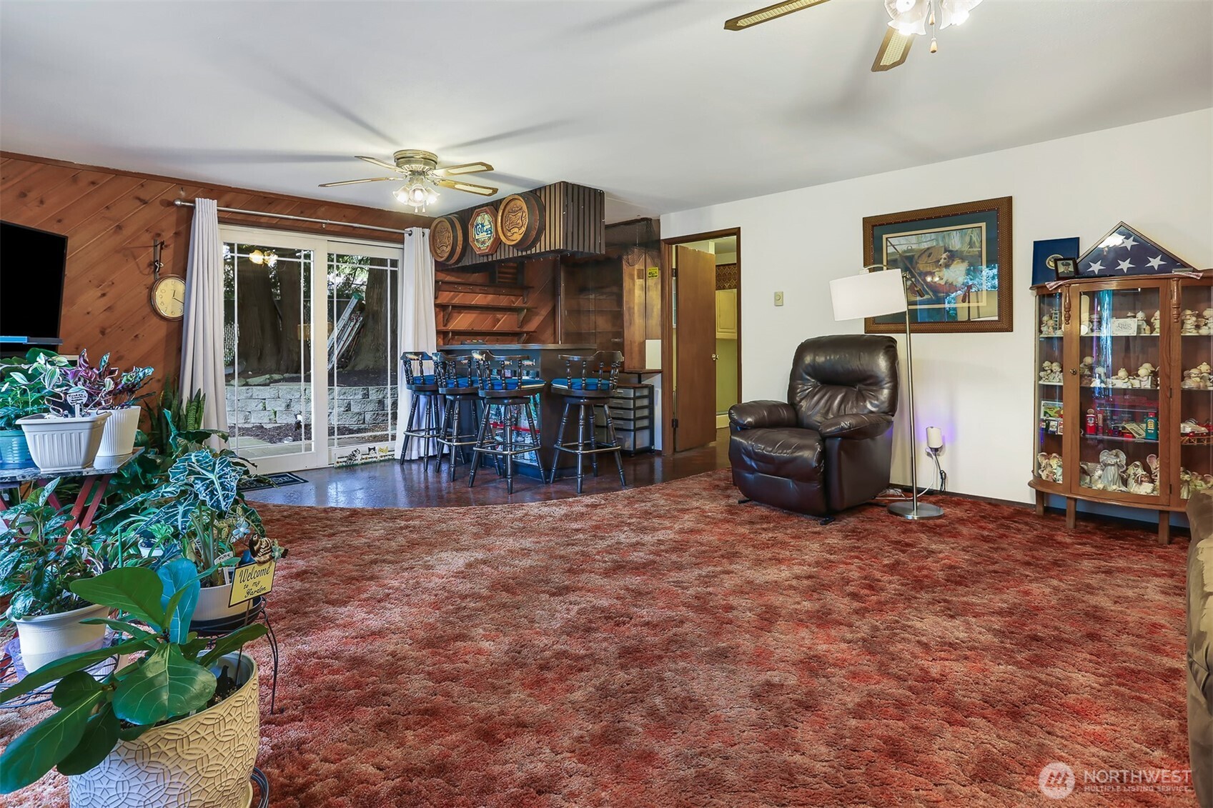 11120 3rd Place Southeast Everett, WA 98208 - Photo 18 of 35 a living room with furniture a piano and a bookshelf