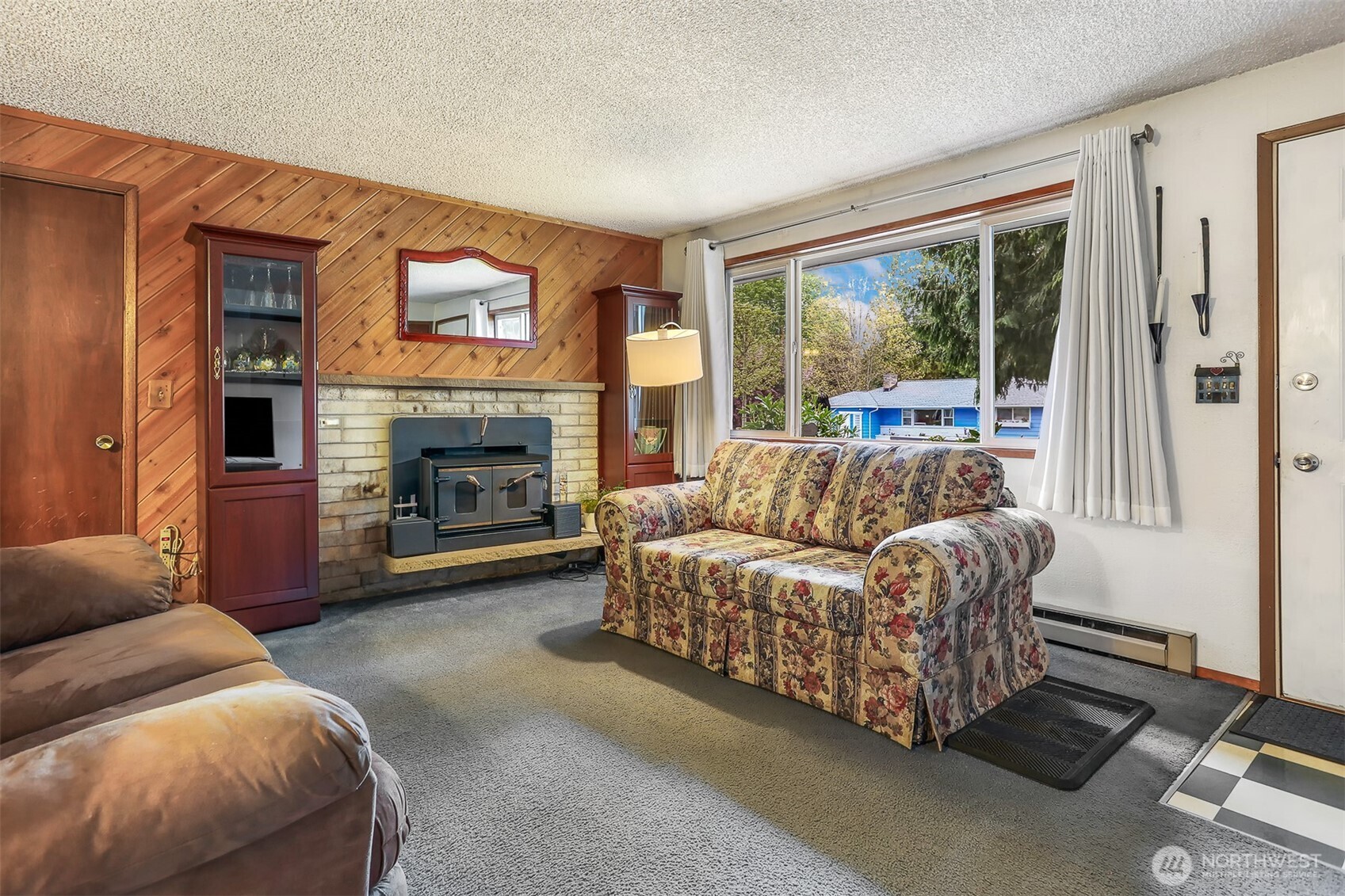 11120 3rd Place Southeast Everett, WA 98208 - Photo 2 of 35 a living room with furniture a large window and a fireplace