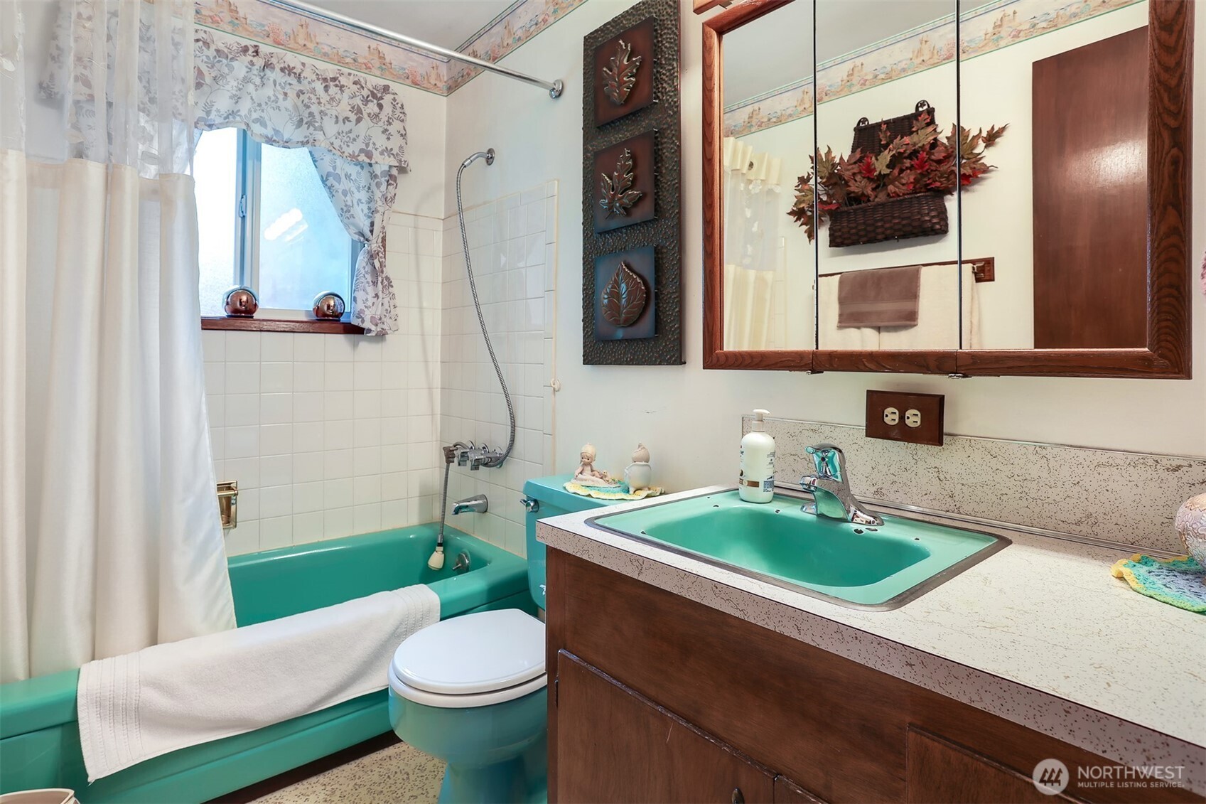 11120 3rd Place Southeast Everett, WA 98208 - Photo 22 of 35 a bathroom with a sink a toilet and a mirror