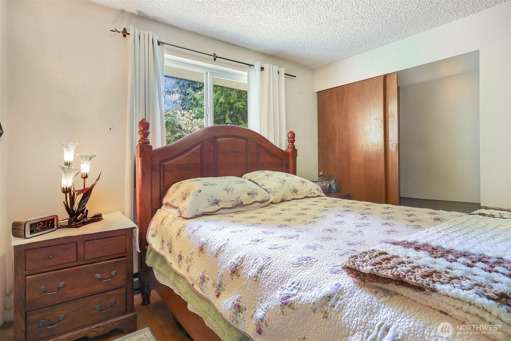 11120 3rd Place Southeast Everett, WA 98208 - Photo 25 of 35 a bedroom with a bed and a window