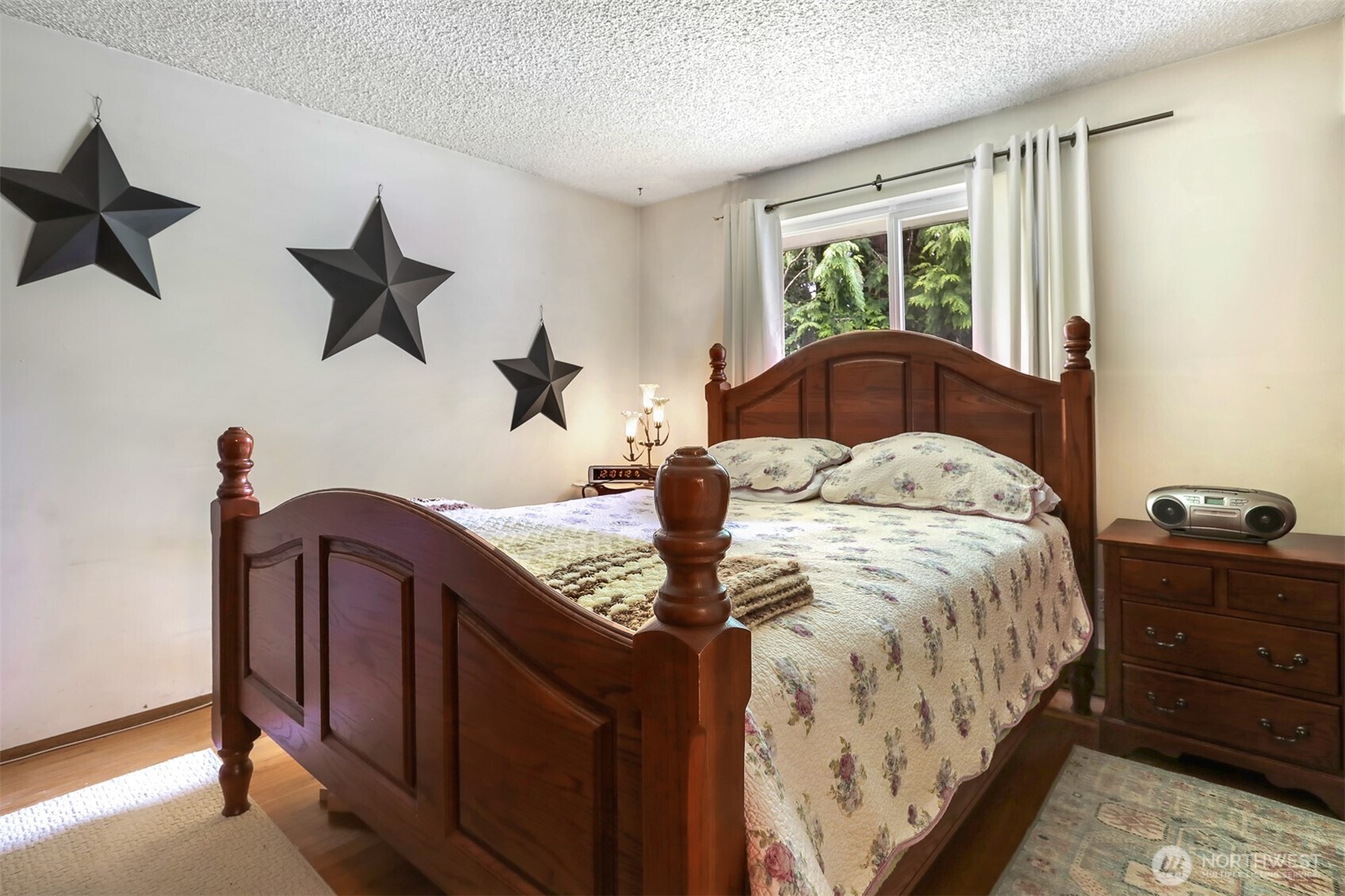 11120 3rd Place Southeast Everett, WA 98208 - Photo 26 of 35 a bedroom with a bed and wooden floor