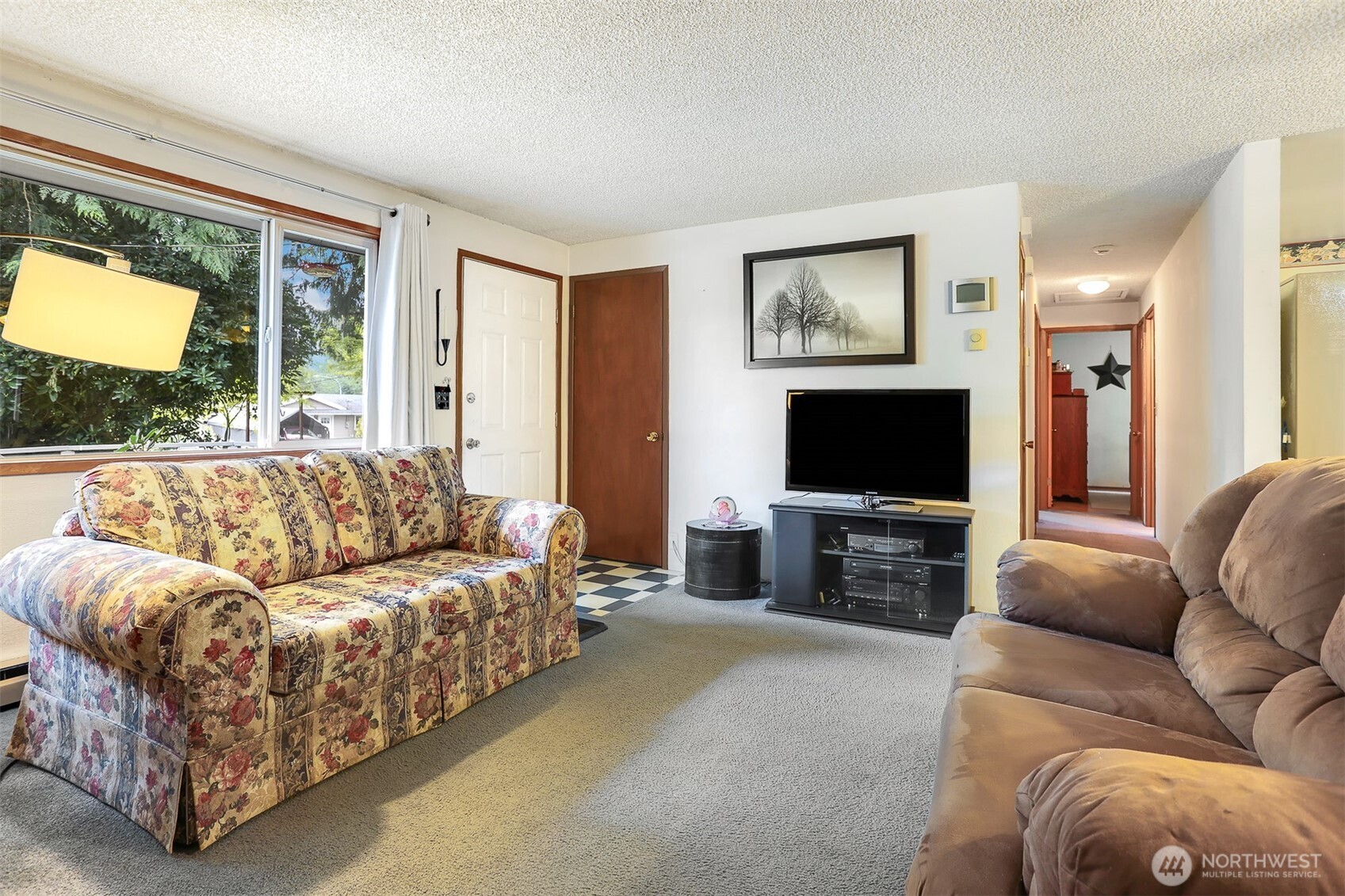 11120 3rd Place Southeast Everett, WA 98208 - Photo 4 of 35 a living room with furniture and a flat screen tv