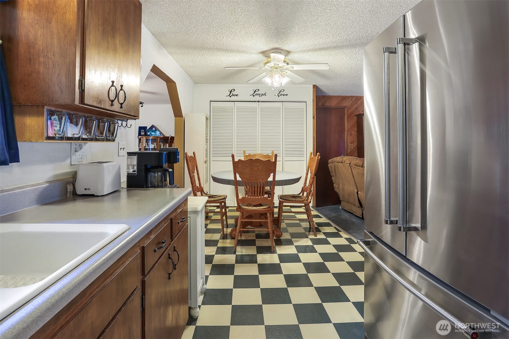 11120 3rd Place Southeast Everett, WA 98208 - Photo 6 of 35 a dining room with furniture and a chandelier