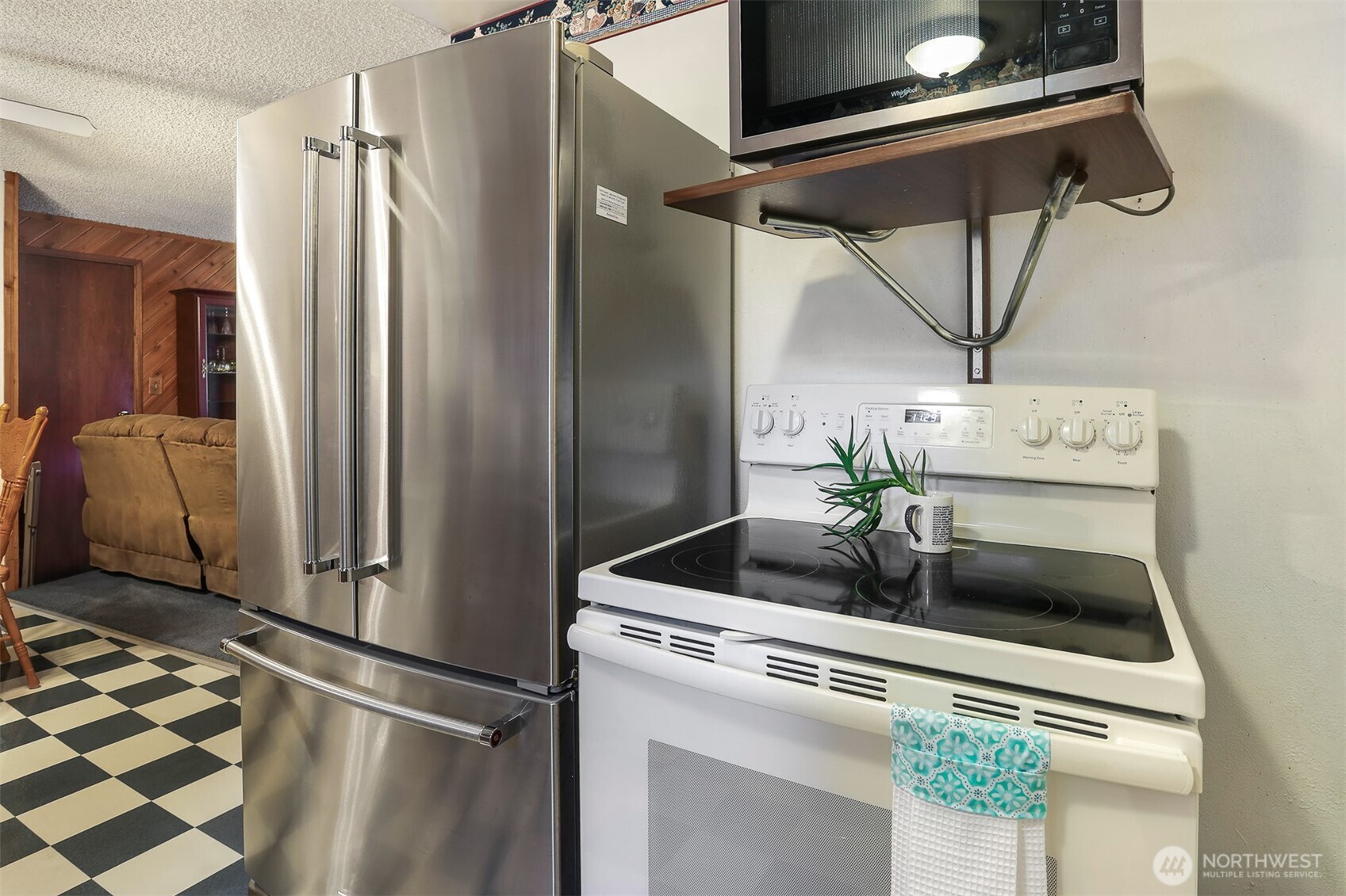 11120 3rd Place Southeast Everett, WA 98208 - Photo 9 of 35 a kitchen with a refrigerator and a sink