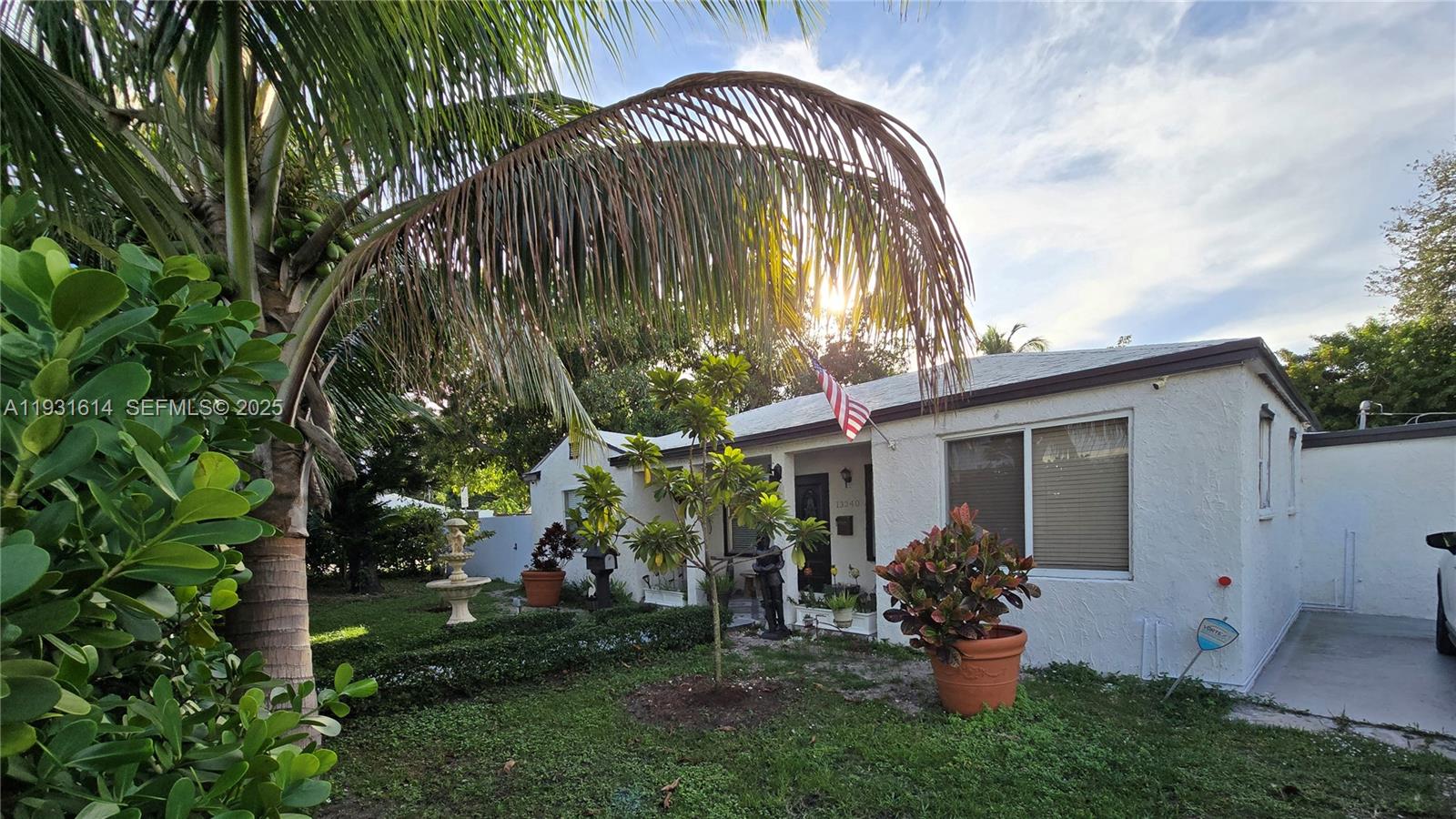 13340 Northeast 16th Avenue North Miami, FL 33161 - Photo 16 of 18 a view of a house with a yard and plants