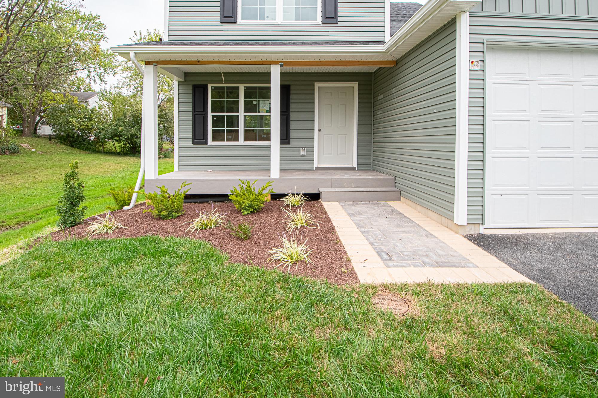 709 Ross Street Winchester, VA 22601 - Photo 3 of 40 a front view of a house with garden