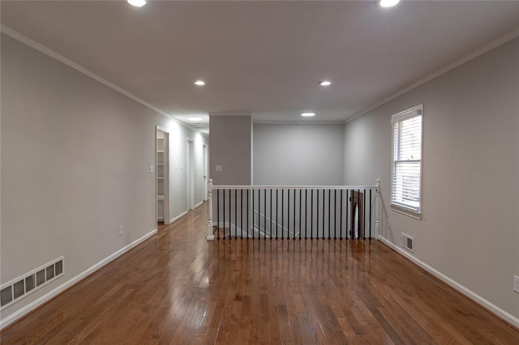 3599 Lower Roswell Road Marietta, GA 30068 - Photo 15 of 34 a view of a hallway with wooden floor