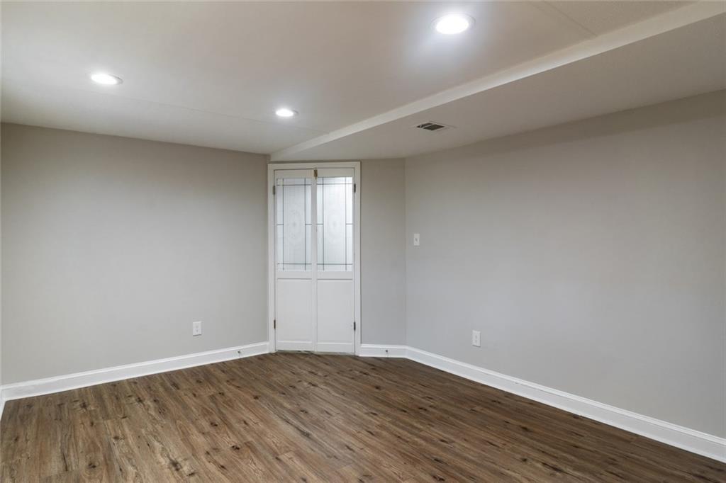 3599 Lower Roswell Road Marietta, GA 30068 - Photo 16 of 34 a view of an empty room with wooden floor