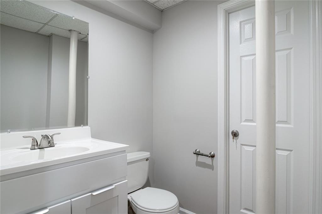 3599 Lower Roswell Road Marietta, GA 30068 - Photo 21 of 34 a bathroom with a sink toilet and vanity