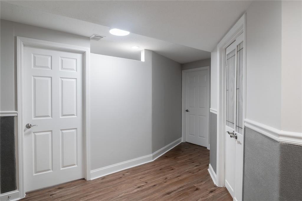 3599 Lower Roswell Road Marietta, GA 30068 - Photo 22 of 34 a view of a hallway with wooden floor