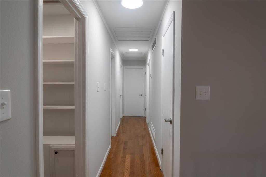 3599 Lower Roswell Road Marietta, GA 30068 - Photo 8 of 34 a view of a hallway with a wooden floor
