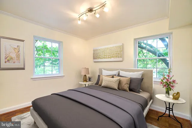 a bedroom with bed and a window