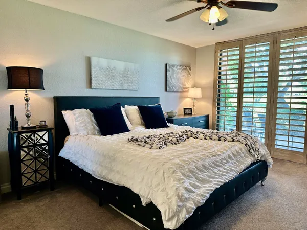 a bedroom with a bed and window