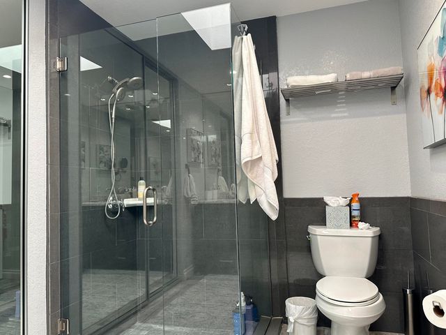 a bathroom with a toilet sink and shower