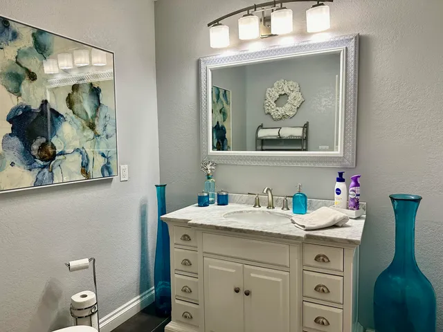 a bathroom with a sink and a mirror