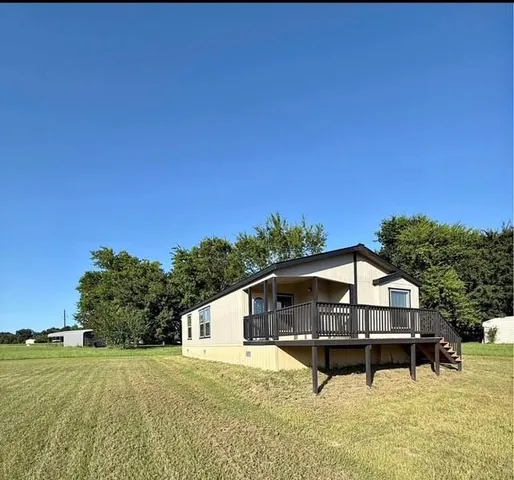 a house with trees in the background