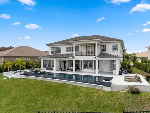 an aerial view of a house with a yard