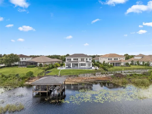 a view of a roof deck with couches and sky view