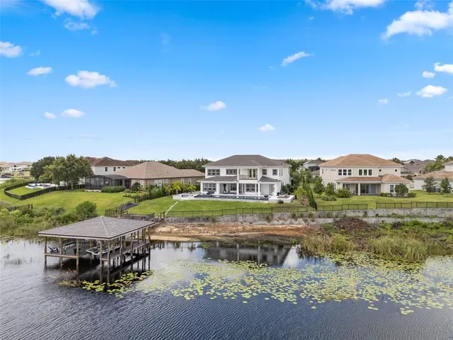 a view of swimming pool with outdoor seating and plants
